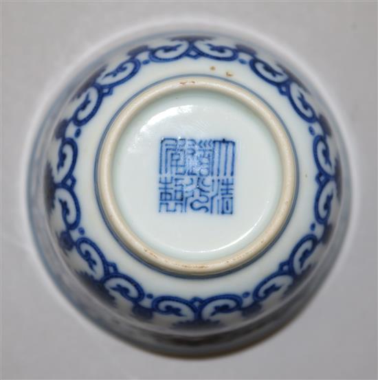 A Chinese blue and white Eight Buddhist emblems cup, bearing a Daoguang seal mark, diameter 7.3cm